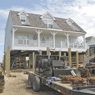 Hollerman house being moved back from the sea.