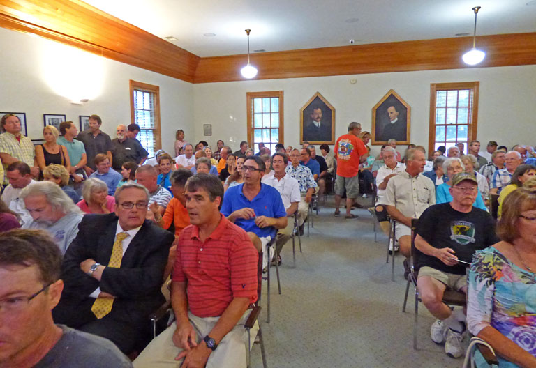 webKHcrwd A more than SRO crowd gathered at Kitty Hawk Town Hall to learn about town and county plans for beach nourishment last night.