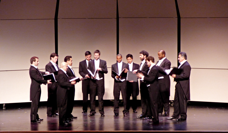Chanticleer on stage at the First Flight High School auditorium.