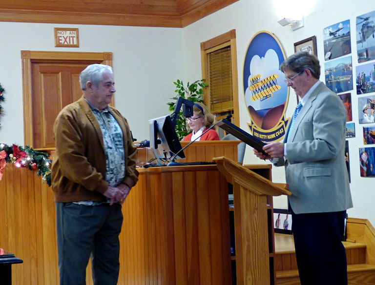 webPerry_perry Retiring Mayor Cliff Perry with incoming Mayor Gary Perry (no relation) receiving resolution of appreciation from Kitty Hawk Town Council.