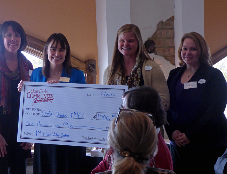 Outer Banks Y receiving award for best video on the use of OBCF funds. (LtoR) Dorothy Killinsworth, board member; Lorelei Costa, OBCF Executive Director; Katie Burgus, Executive Director Outer Banks Y; Laura Kirby, Outer Banks Y.
