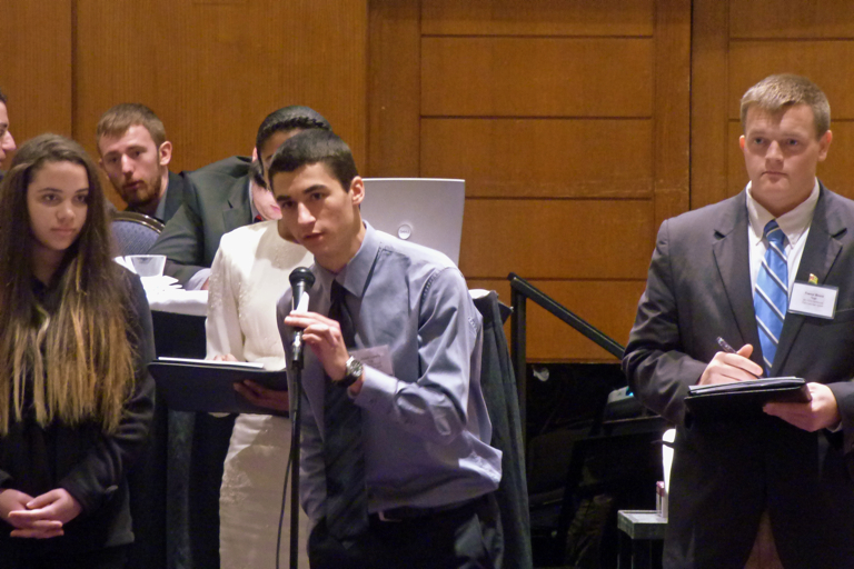 Joseph Lupetin responding to a question about a resolution Togo was co-sponsoring. Trevor Bruce is to the right of him.