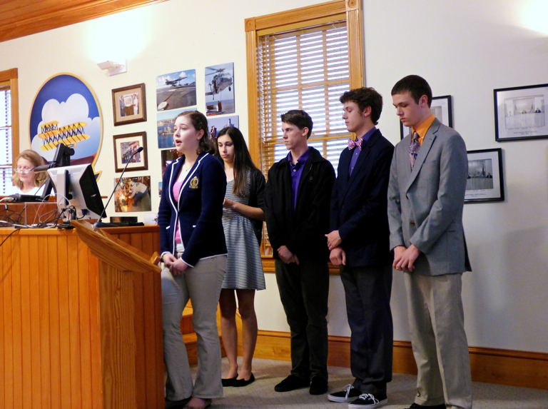 Second presenters.Kelly Weisbecker at the podium. LtoR behind her: Carla Hardy, Ricky Carroll, Hunter Savage, Justin Savage.