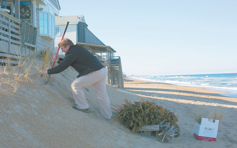 Donnie King working to preserve the beach. Photo K. Wilkins Photography.