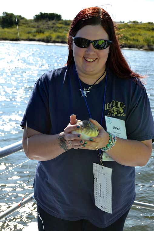 Elaine Lubosch of Dare County holds a fish that she caught on the Crystal Dawn. Photo Credit: Use Jason M. Foster/Thin Blue Line Productions