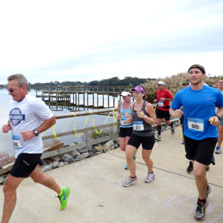Runners along Kitty Hawk Bay in Kitty Hawk.