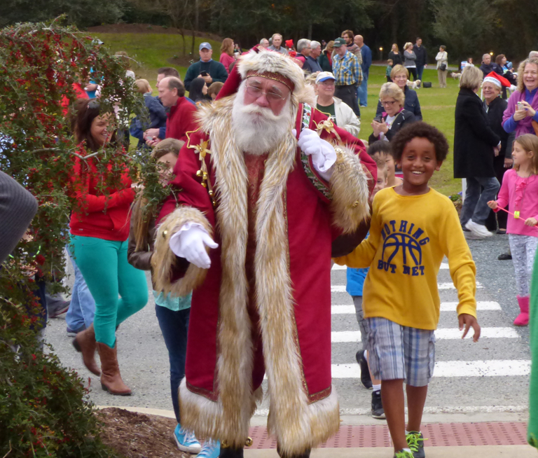Santa arriving at the Duck Yuletide Celebration.