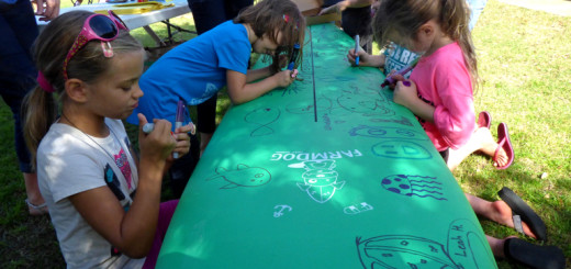 Decorating the Farmdog Surfboard at the 25th Annual DCAC Artrageous.