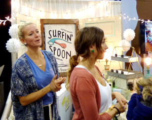 Whitney Hines, in blue, at the Surfin' Spoon booth. Whitney and her husband, Jesse own the frozen yogurt shop that came to the Expo for the first time this year. Photo, Kip Tabb.