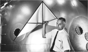 Francis Rogallo posing with a mock-up of an early hang glider.