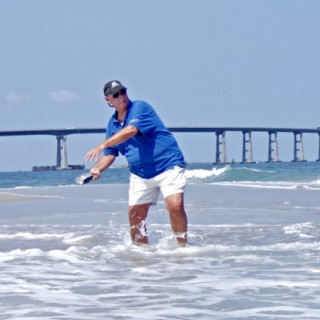 Larry Hansen, ship's carpenter, launching his ship from Oregon Inlet.