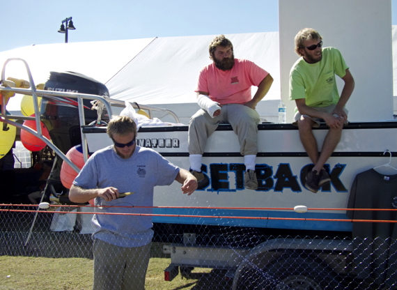 At the Outer Banks Seafood Festival. That's (LtoR)Jake Griffin working on a gill net with Dalton Wilson and Willie Rawls looking on. Photo Kip Tabb
