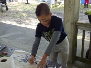 Great art and a budding football star still in pads.
