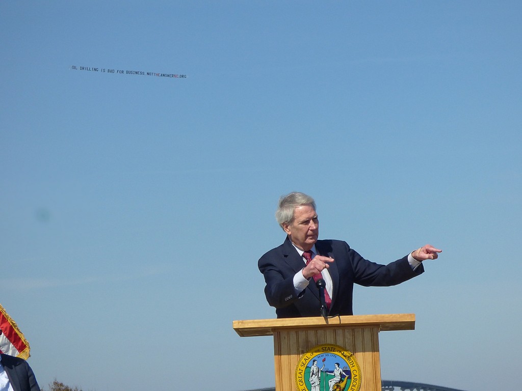 Walter Jones with Don't Drill banner above his head.