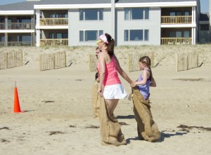 Mother and daughter in sack obstacle.