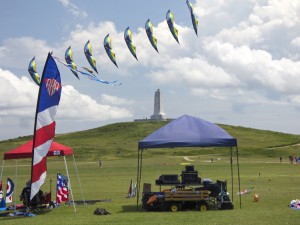 A stack of two line delta kites flying in the kite area. Photo, Kip Tabb