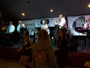 Kicking off a day of dancing and music. That's the Riff Tides on stage.