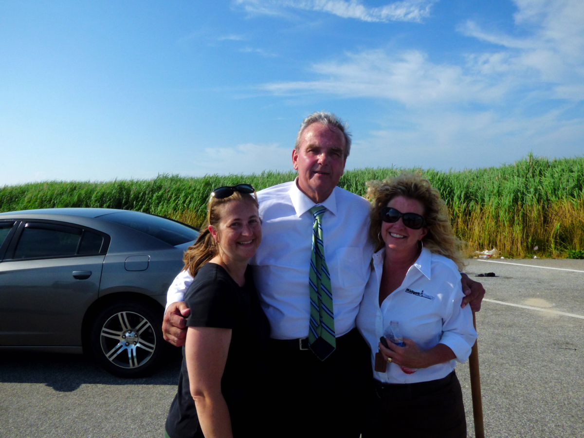Hatteras Island Bridge Mom's Natalie (L)Cavanaugh and Beth Midgett with Warren Judge at the Bonner Bridge groundbreaking.
