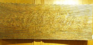 Travis Fowler's untitled brass leaf on wood panel.