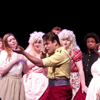 Zachary Pfrimmer as Gaston explaining to his adoring fans the nuances of hunting.